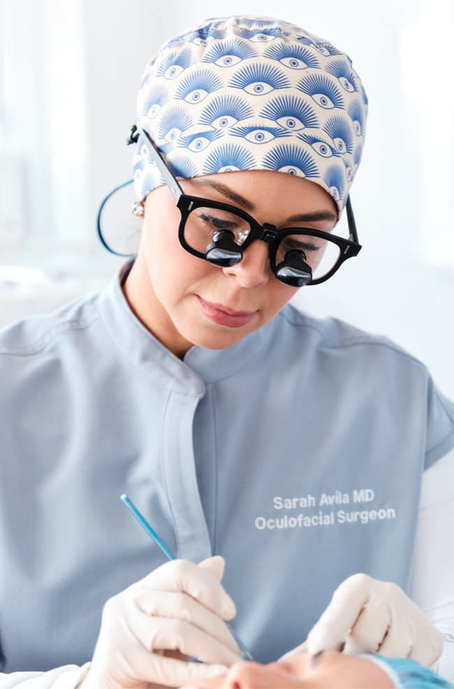 Dr. Avila testing patient eye