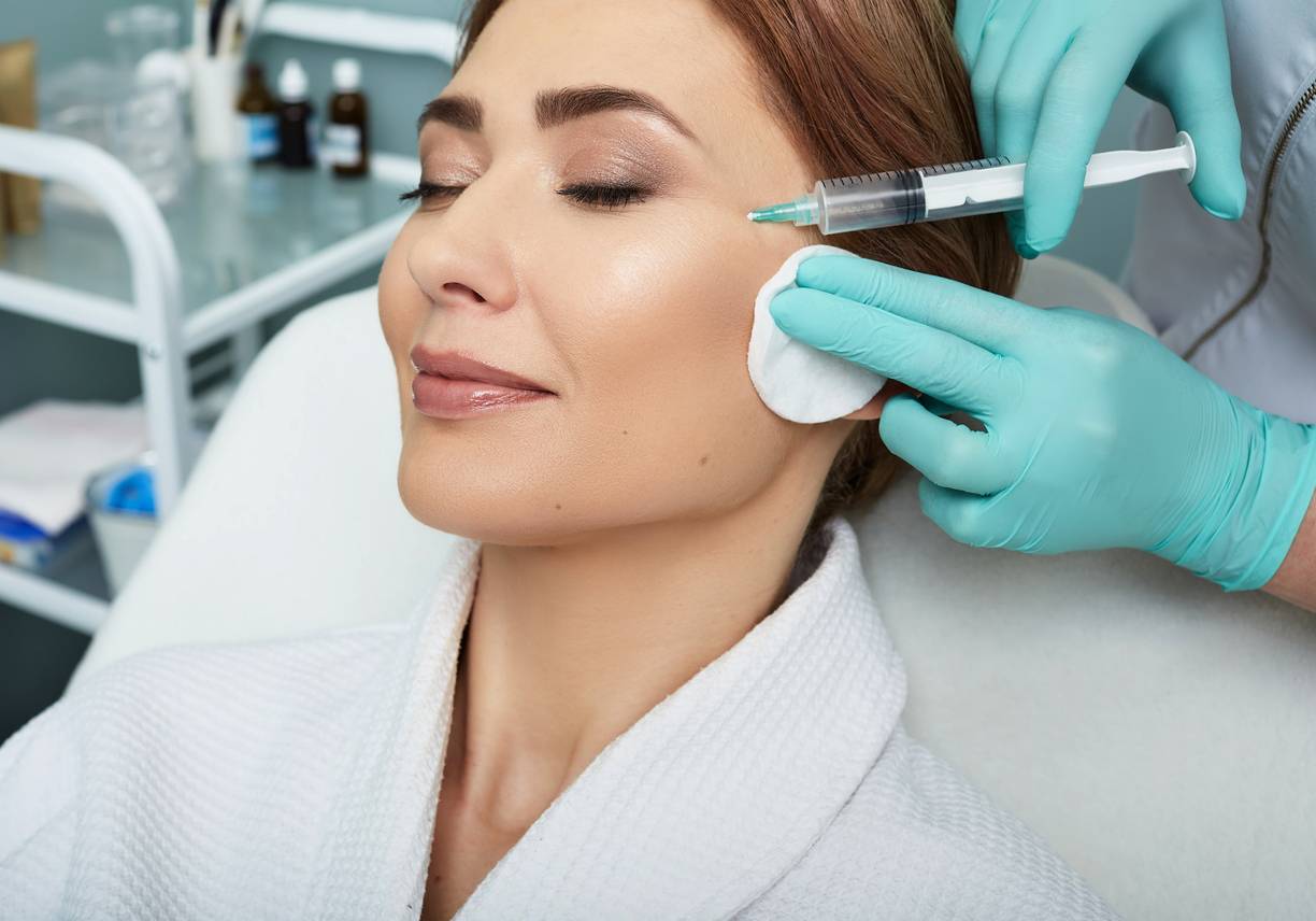 Woman undergoing a cosmetic procedure.